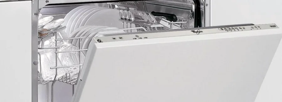 Dishwasher open with glasses in the top rack