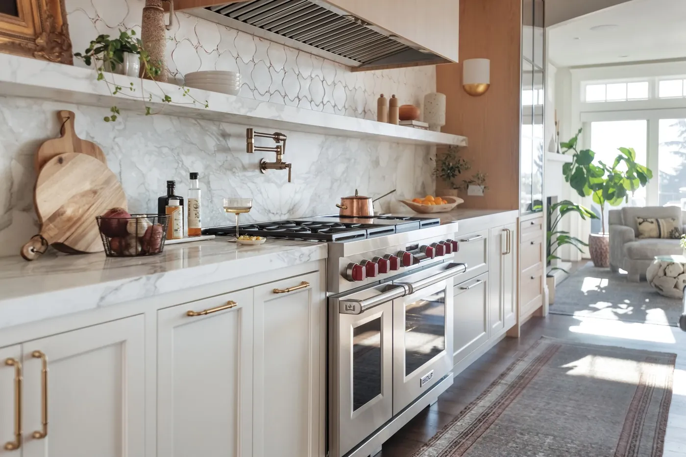 Wolf range under open shelves in a farmhouse kitchen